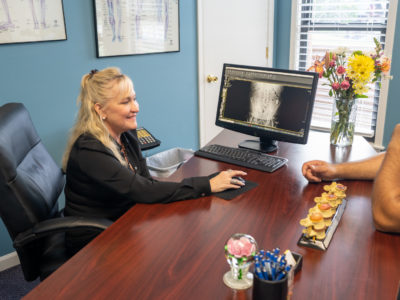 Dr. Amaral speaking to a patient Dr. Amaral speaking to a patient