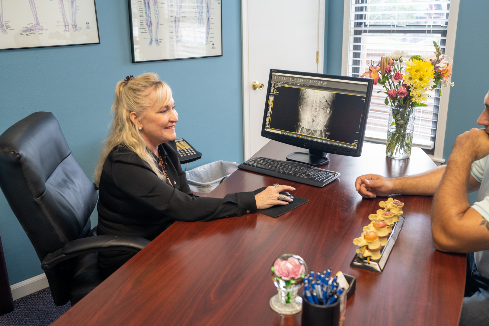 Dr. Amaral speaking to a patient