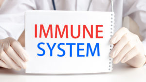 Photo of a card that says "immune system" letting people know that they can boost their immune system with chiropractic care.