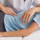 Chiropractor evaluating a patient with degenerative disc disease and providing spinal care treatment | Chiropractor in Managing Degenerative Disc Disease