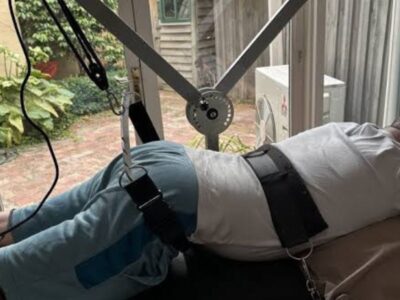 Patient recovering after spinal decompression therapy with guidance from a chiropractor | Post Spinal Decompression Therapy Recovery